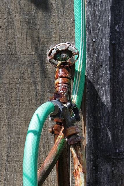 A leaking pipe that's hooked up to a hose